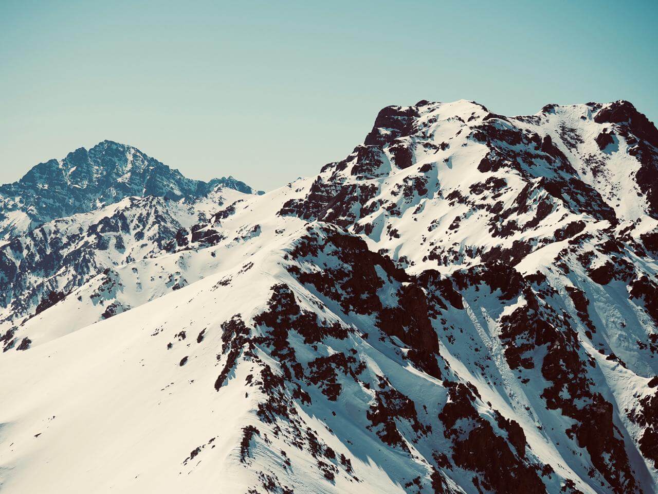 Snow-covered Mount Toubkal and Aksoual Summit in Morocco's High Atlas Mountains