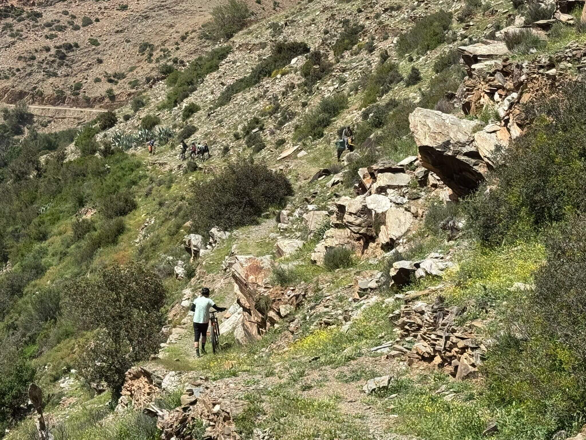 Mountain biker riding a trail in the High Atlas Mountains of Morocco