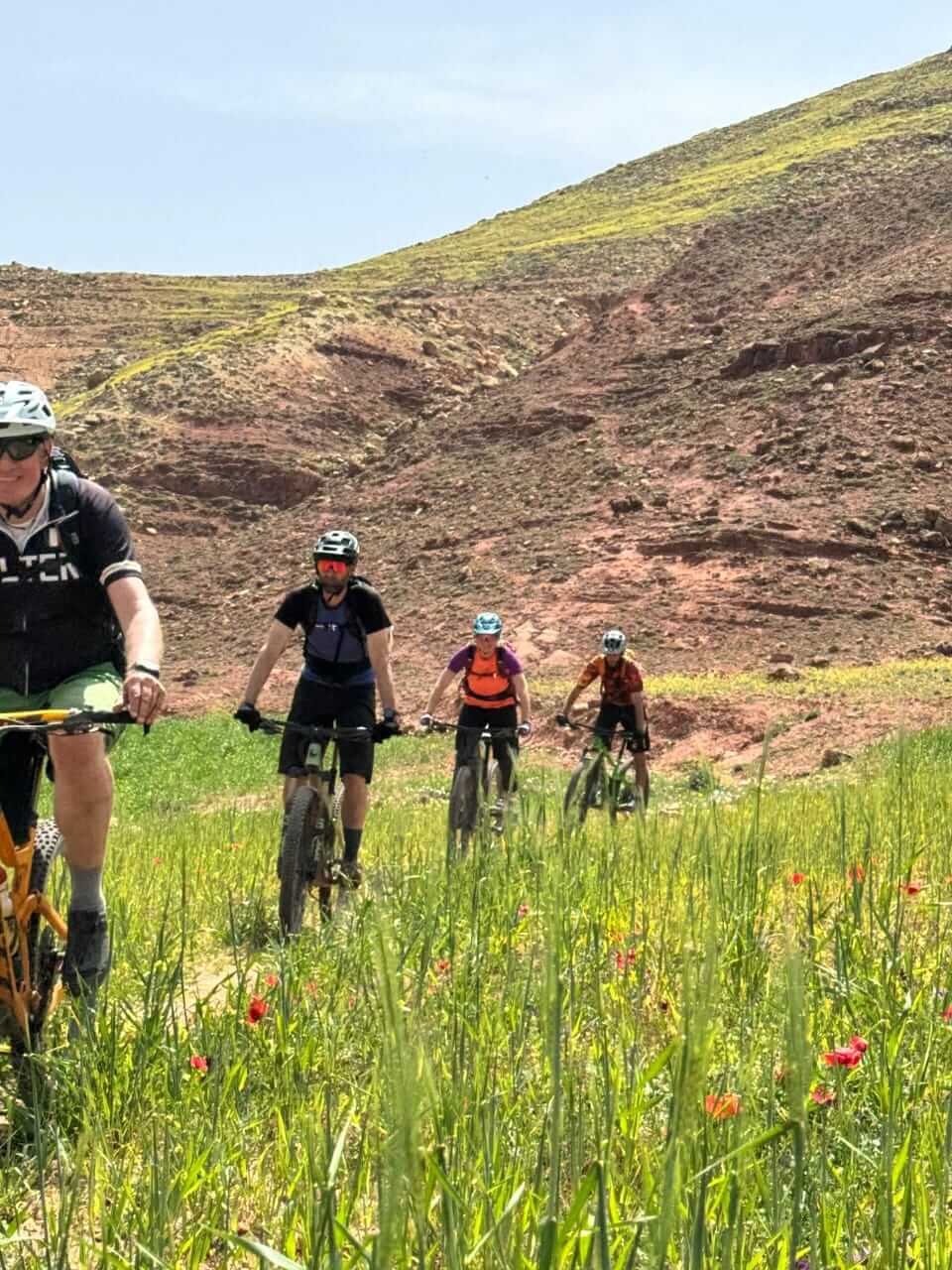 Mountain bikers riding together through the Moroccan mountains