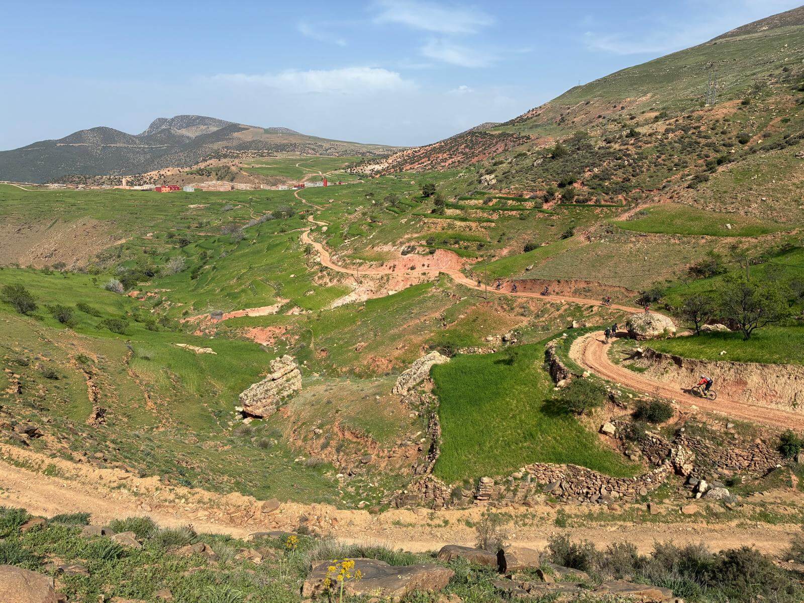 Mountain bike trail through a green valley in Morocco