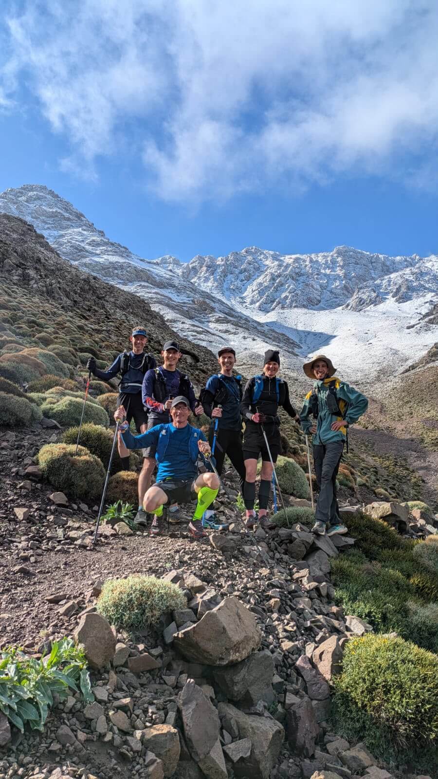 Tizi Likemt Trail Running Preparation Trail runners preparing for a mountain climb toward Tizi Likemt