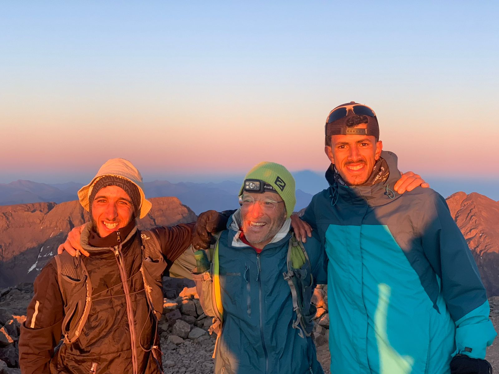 Trail running team preparing for a mountain adventure in Morocco's High Atlas