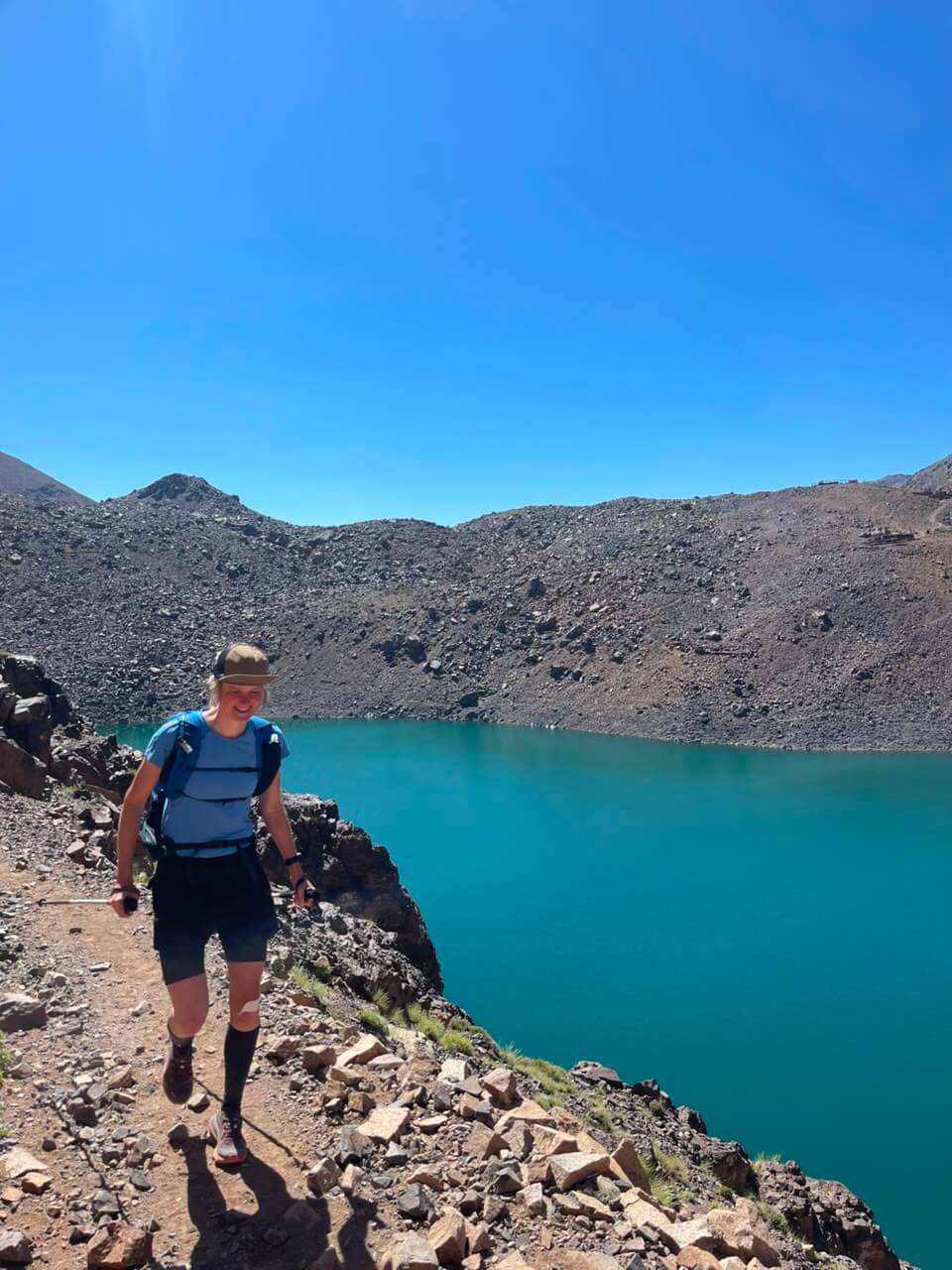 Trail Running at Lake Ifni — Toubkal Massif Trail runner beside Lake Ifni in the Toubkal Massif of Morocco's High Atlas Mountains