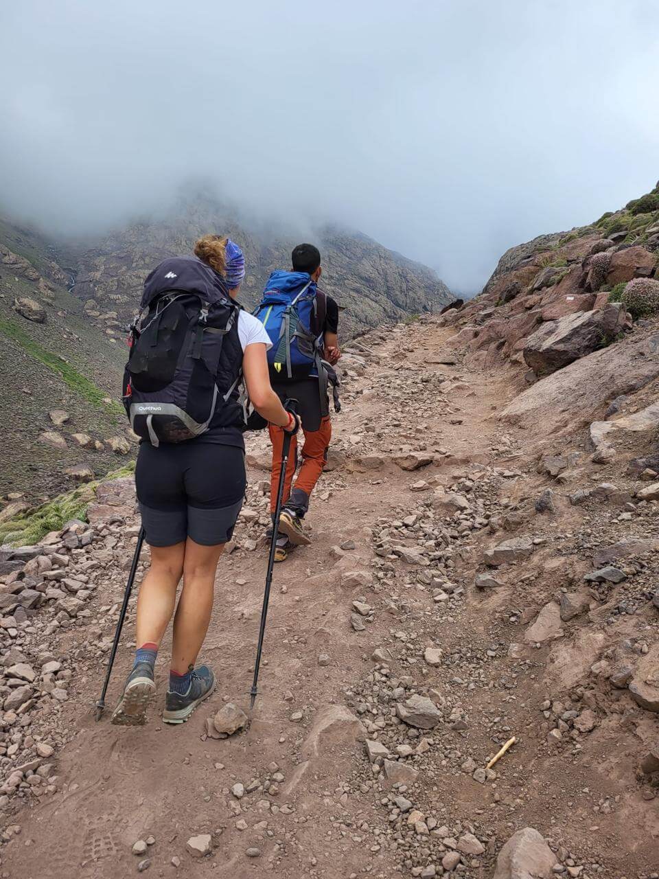 Trekking above Sidi Chamharouch on the trail from Imlil to Toubkal Refuge in Morocco's High Atlas Mountains