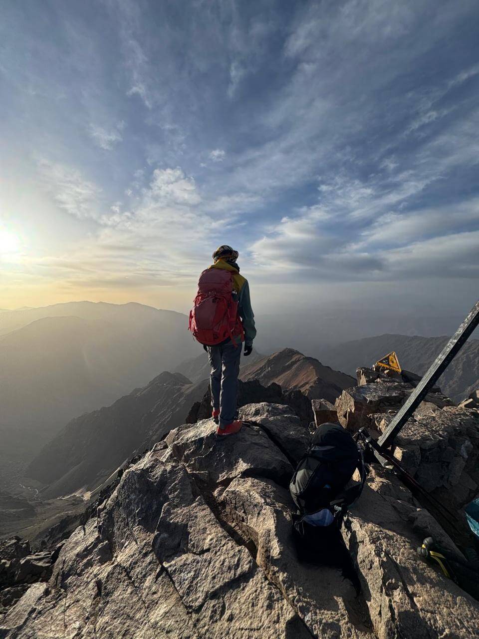 Sunrise from Mount Toubkal summit overlooking the High Atlas Mountains of Morocco