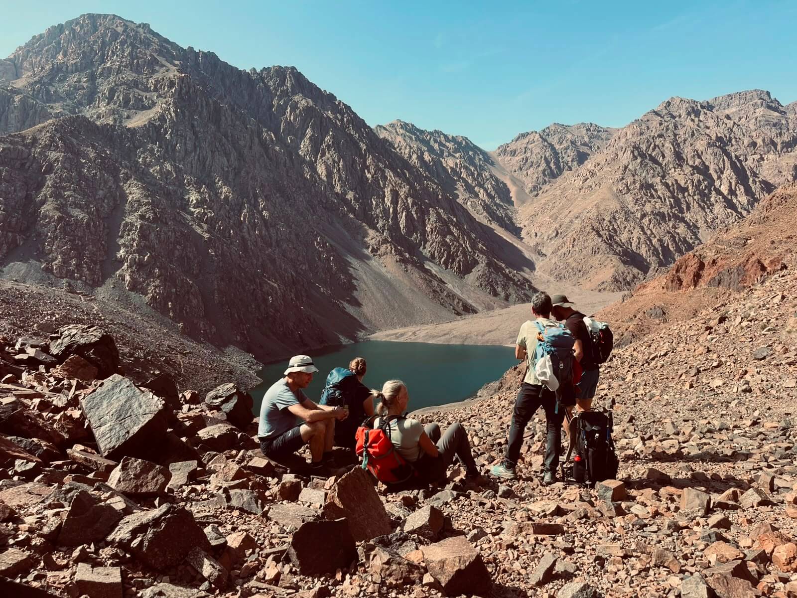 Lake Ifni alpine lake surrounded by High Atlas Mountains on the Toubkal Circuit Trek in Morocco